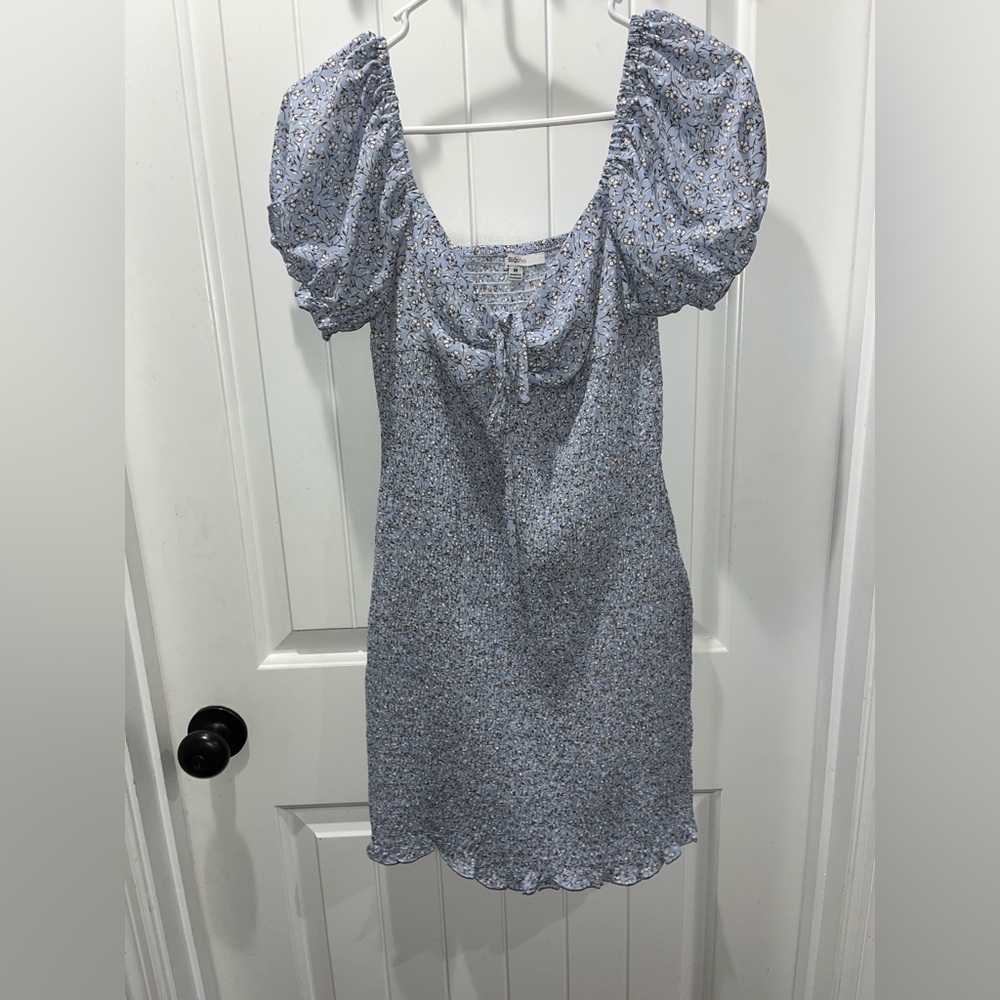 Tight fitting floral dress. Off the shoulder or on. Tie front.